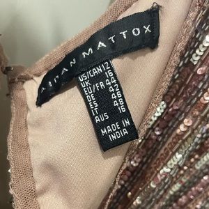 Pretty Aidan Mattox dress size US 12 with sequins on it. V neck front and back.